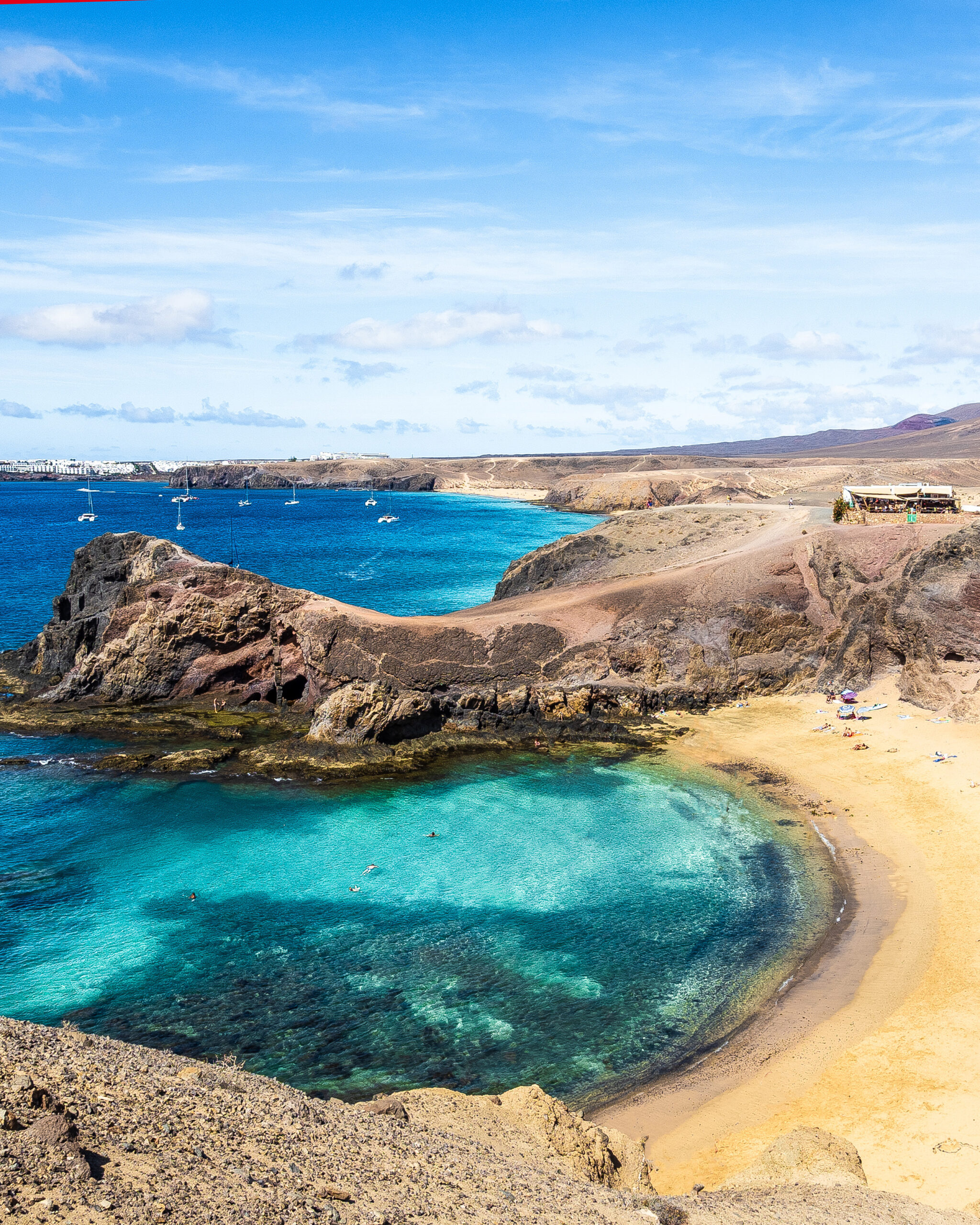 Landscape with turquoise ocean water on Papagayo beach, Lanzarote, Canary Islands, Spain